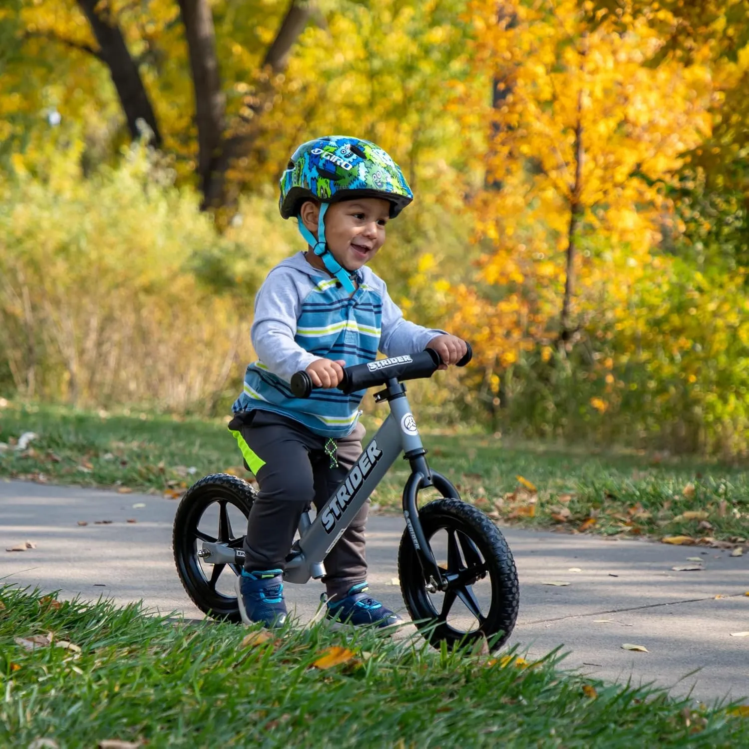 Strider 12” Sport Bike - No Pedal Balance Bicycle for Kids 1 to 4 Years - Includes Safety Pad, Padded Seat, Mini Grips & Flat-Free Tires - Tool-Free Assembly & Adjustments